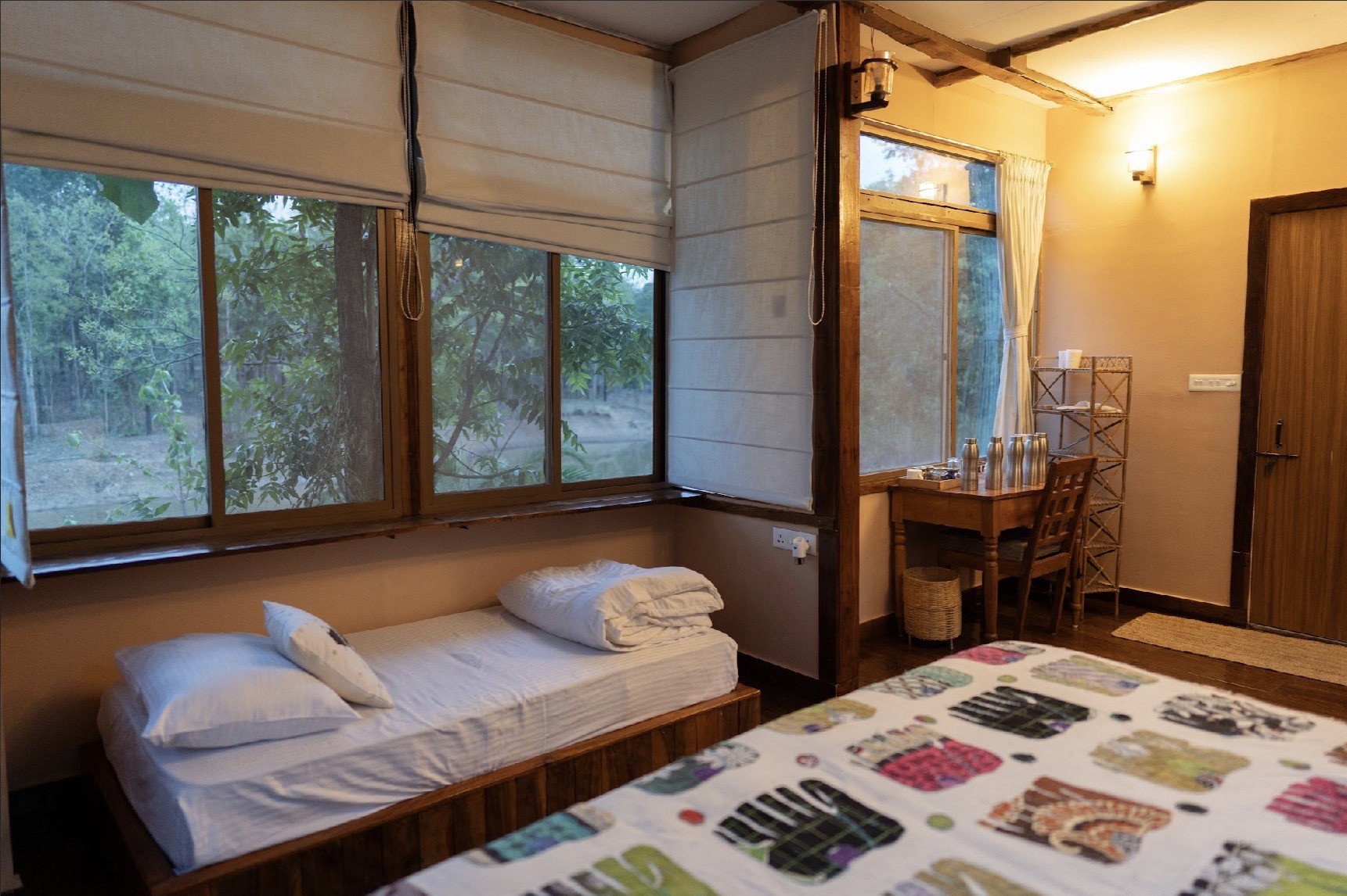 A comfortable forest cabin interior with views of the trees