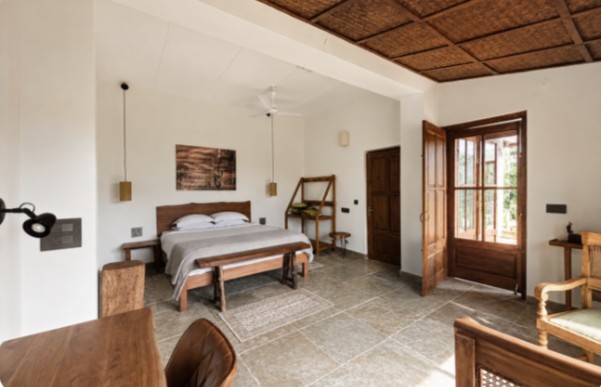 A spacious lodge bedroom with natural furnishings